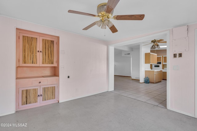 unfurnished living room featuring ceiling fan and light tile patterned floors