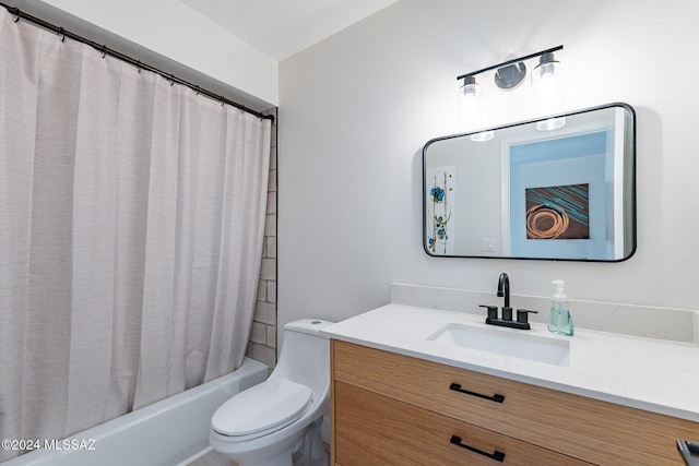 full bathroom featuring shower / tub combo with curtain, vanity, and toilet