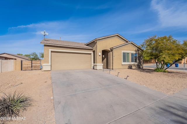 ranch-style house featuring a garage