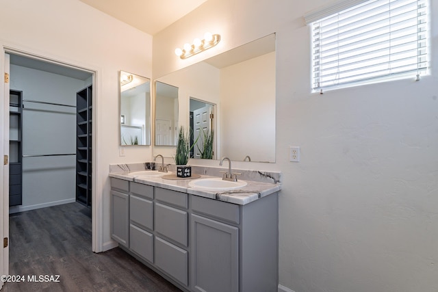 bathroom featuring vanity and hardwood / wood-style flooring