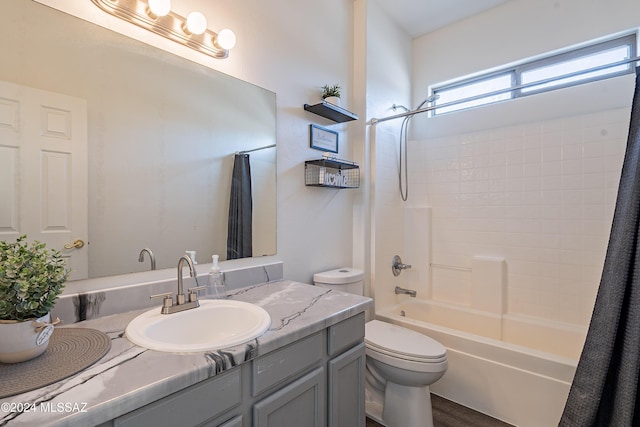 full bathroom with toilet, vanity, shower / bath combination with curtain, and hardwood / wood-style flooring