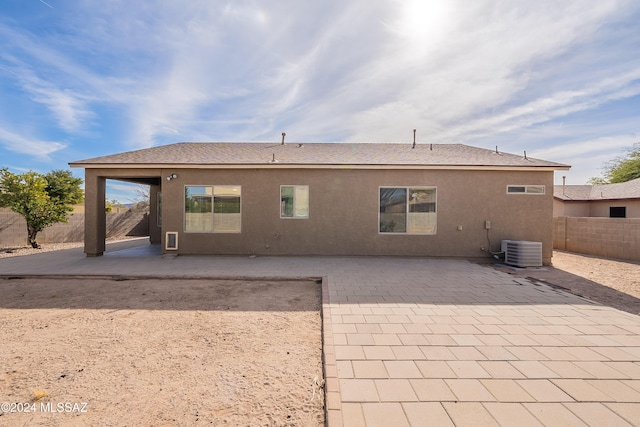 back of house with a patio area and central air condition unit