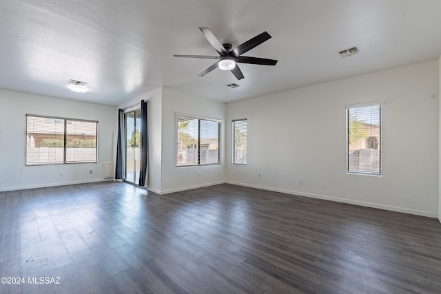 unfurnished room with dark hardwood / wood-style floors and ceiling fan