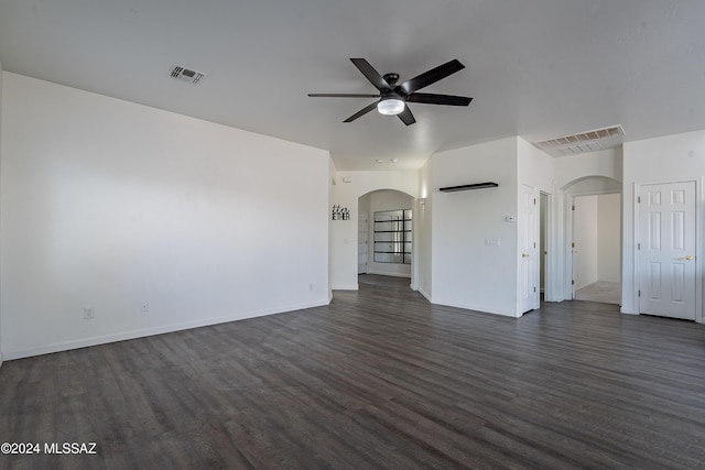 unfurnished living room featuring dark hardwood / wood-style floors and ceiling fan