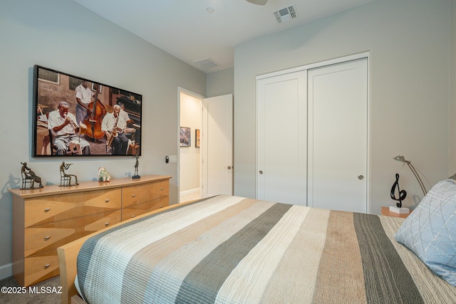 bedroom featuring carpet flooring and a closet