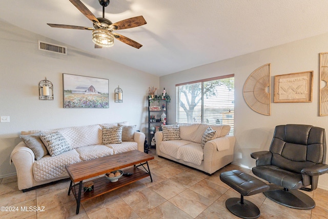 living room with ceiling fan and vaulted ceiling