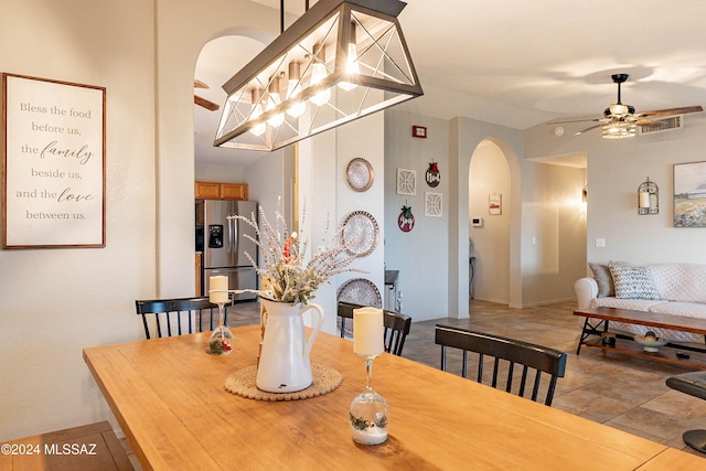 dining area with ceiling fan and light tile patterned flooring