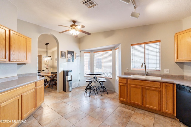 kitchen with dishwasher, sink, ceiling fan, decorative light fixtures, and light tile patterned flooring