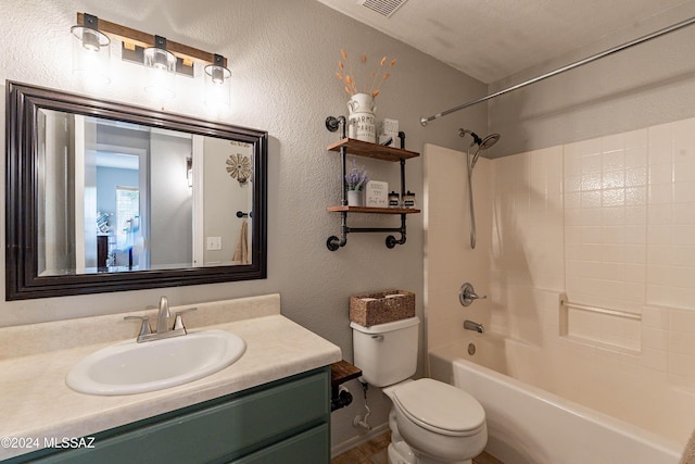 full bathroom with vanity, toilet, a textured ceiling, and bathtub / shower combination