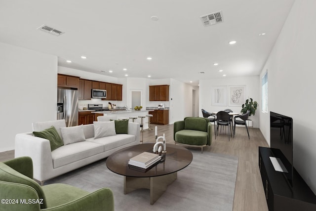 living room featuring light wood-type flooring