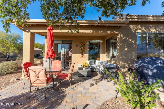 view of patio / terrace featuring outdoor lounge area and a grill