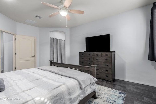 bedroom with ceiling fan and dark hardwood / wood-style floors