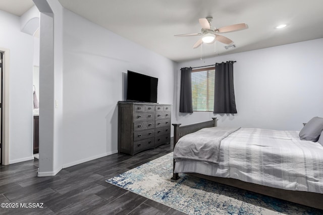 bedroom featuring ceiling fan and dark hardwood / wood-style flooring