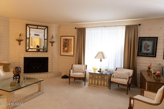 carpeted living area featuring a fireplace