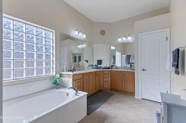 bathroom featuring tile patterned flooring, vanity, and a bathtub