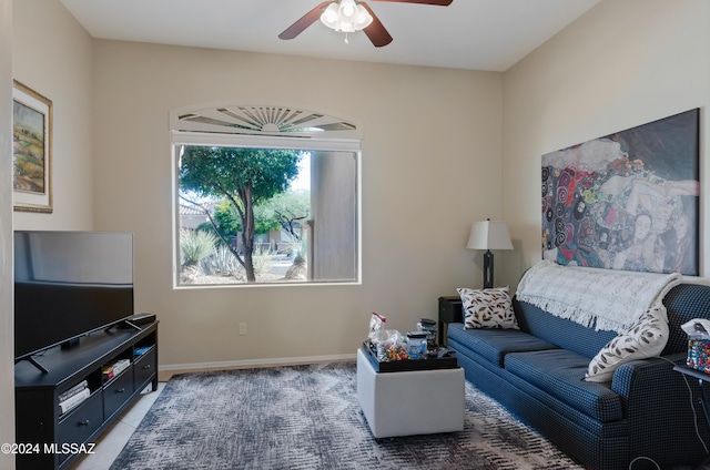 tiled living room with ceiling fan