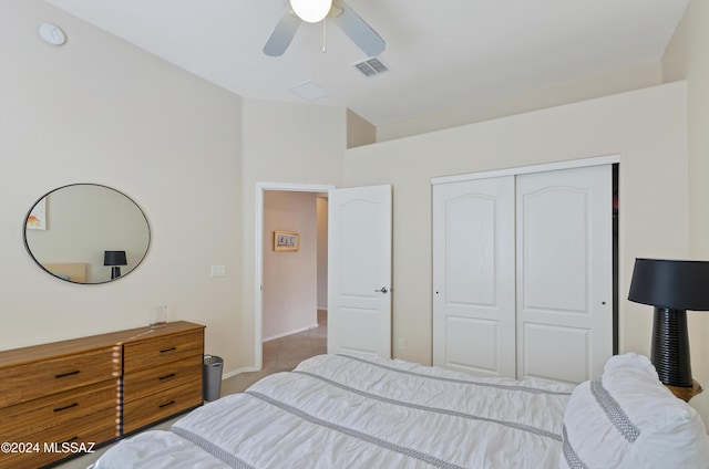 tiled bedroom featuring a closet and ceiling fan