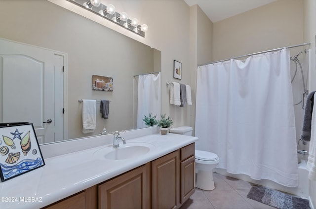 full bathroom with toilet, shower / bath combo, vanity, and tile patterned floors