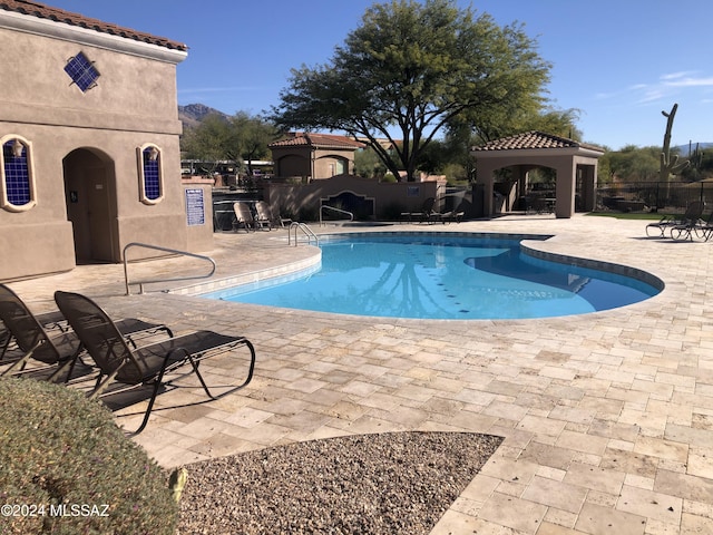 view of pool with a gazebo and a patio