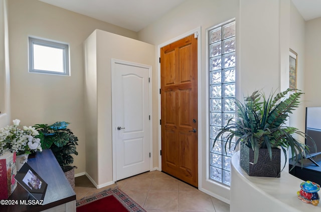 entrance foyer with light tile patterned floors