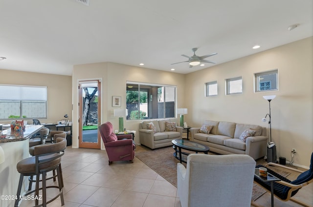 tiled living room featuring ceiling fan