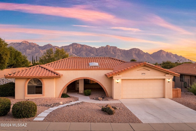 1620 E Chisholm Ln, Oro Valley, AZ 85755 - mediterranean / spanish house featuring a mountain view and a garage