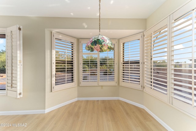 unfurnished dining area with light hardwood / wood-style flooring