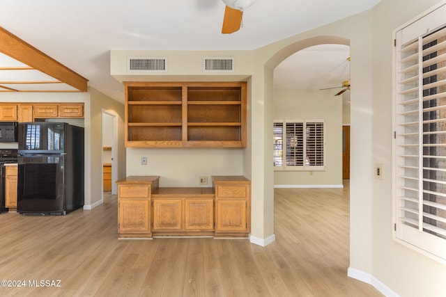 kitchen featuring black appliances and light hardwood / wood-style floors