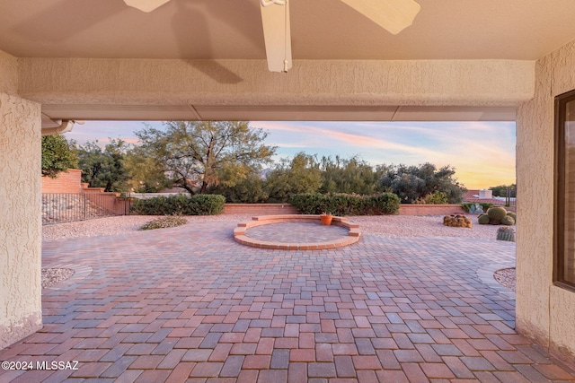 view of patio terrace at dusk