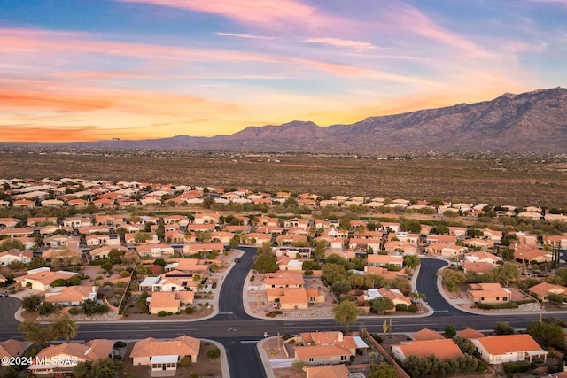 aerial view at dusk with a mountain view