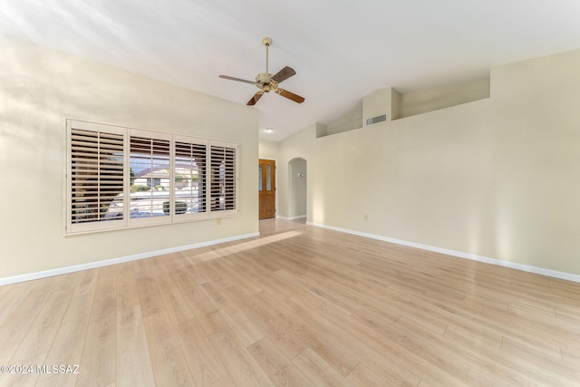 unfurnished living room with light hardwood / wood-style floors, vaulted ceiling, and ceiling fan