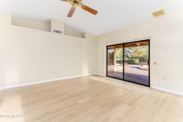 unfurnished room featuring ceiling fan, vaulted ceiling, and light wood-type flooring