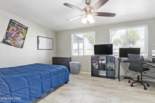 bedroom featuring multiple windows and ceiling fan