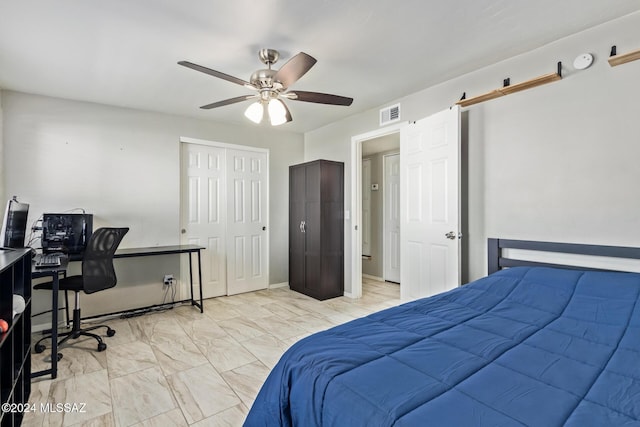 bedroom with ceiling fan and a closet