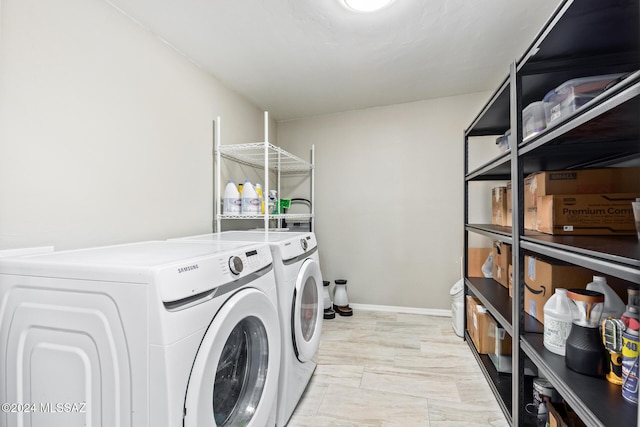 laundry room with washing machine and clothes dryer