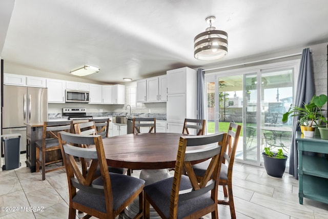 dining space with sink