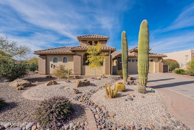 2435 E Mayview Dr, Green Valley, AZ 85614 - mediterranean / spanish-style home with driveway, a garage, stucco siding, and a tiled roof