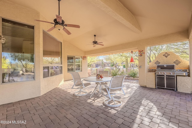 view of patio with ceiling fan and a grill