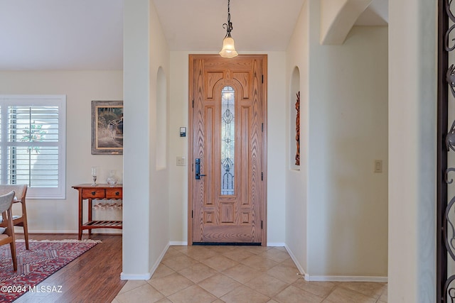2435 E Mayview Dr, Green Valley, AZ 85614 - entrance foyer featuring arched walkways, healthy amount of natural light, and baseboards