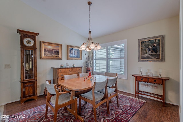 dining room featuring a chandelier, dark hardwood / wood-style flooring, and vaulted ceiling