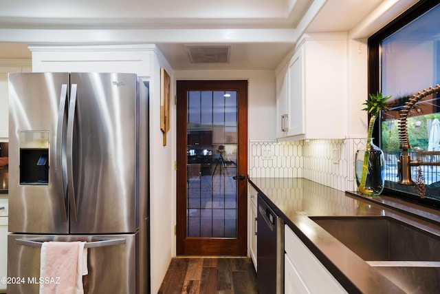 kitchen featuring dishwasher, dark wood-type flooring, stainless steel refrigerator with ice dispenser, backsplash, and white cabinets