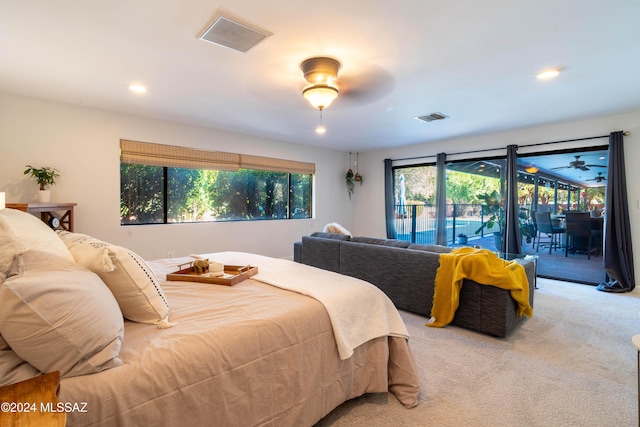 carpeted bedroom with access to exterior and ceiling fan