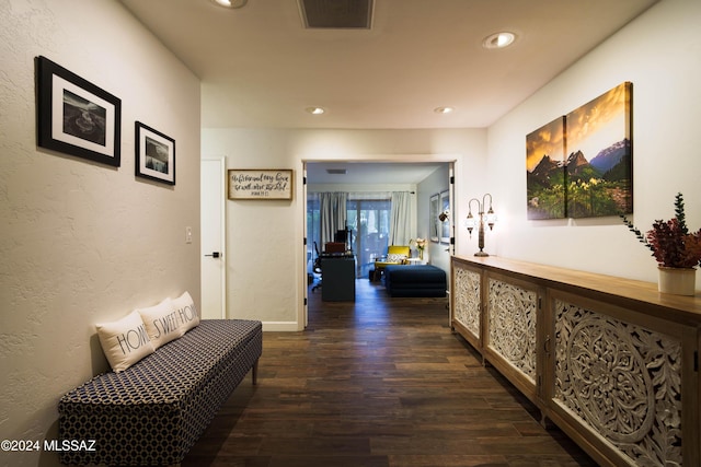 hall with dark hardwood / wood-style floors