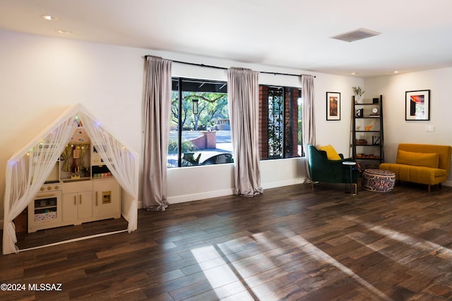 unfurnished room with dark hardwood / wood-style flooring