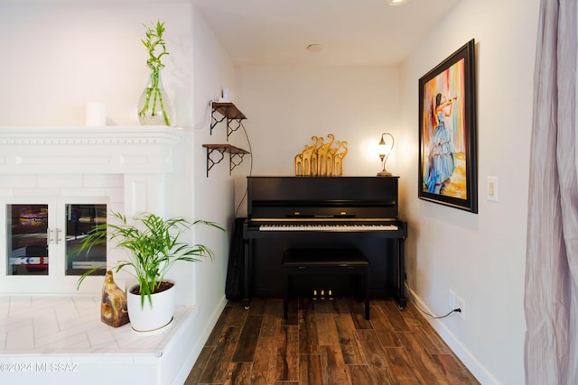 miscellaneous room with dark wood-type flooring