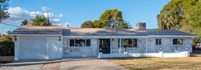 ranch-style house featuring a garage