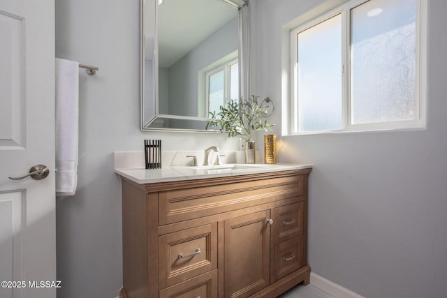 bathroom with vanity and plenty of natural light