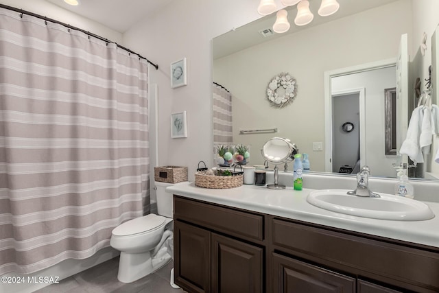 bathroom with tile patterned floors, vanity, and toilet