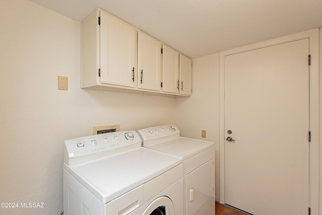 laundry area with cabinets and independent washer and dryer