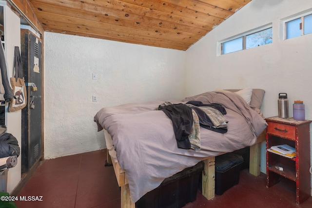 bedroom featuring wood ceiling and vaulted ceiling